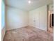 Neutral bedroom featuring carpet, a window with blinds, and double-door closet at 6780 Coral Berry Dr, Mount Dora, FL 32757