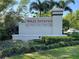 Elegant entrance sign for Holly Estates community surrounded by lush landscaping at 6780 Coral Berry Dr, Mount Dora, FL 32757