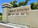 Holly Estates entrance sign featuring a stone tile backdrop and cascading water features at 6780 Coral Berry Dr, Mount Dora, FL 32757