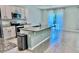Spacious kitchen with stainless steel appliances, granite countertops, and a large island for meal preparation at 6780 Coral Berry Dr, Mount Dora, FL 32757
