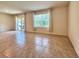 Bright living room features tile floors, lots of natural light, and a sliding glass door to the outdoor patio at 6780 Coral Berry Dr, Mount Dora, FL 32757