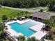 Community pool area featuring lounge chairs and covered seating at 6780 Coral Berry Dr, Mount Dora, FL 32757
