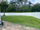 Expansive backyard with well-maintained lawn and privacy fence, offering ample space for recreation and relaxation at 7561 Colbury Ave, Windermere, FL 34786