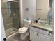 Bathroom featuring a glass shower, marble countertop, and modern vessel sink at 7561 Colbury Ave, Windermere, FL 34786