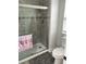 Bathroom featuring a tiled shower with a glass door at 7561 Colbury Ave, Windermere, FL 34786