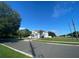 Street view of a two-story home with a landscaped yard on a clear day at 7561 Colbury Ave, Windermere, FL 34786