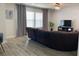 Spacious living room with hardwood floors, modern lighting, and a comfortable sectional sofa at 7561 Colbury Ave, Windermere, FL 34786