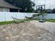 Spacious brick patio featuring hammocks and a basketball hoop, perfect for outdoor activities and relaxation at 7561 Colbury Ave, Windermere, FL 34786