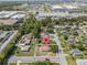 Aerial view of home with surrounding neighborhood near commercial area at 7701 Cassino Ave, Orlando, FL 32819