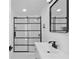 Modern bathroom features a black framed glass shower and sleek vanity at 7701 Cassino Ave, Orlando, FL 32819