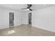 Spacious bedroom with tiled floors, ensuite bathroom, and bright lighting at 7701 Cassino Ave, Orlando, FL 32819