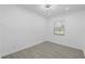 Well-lit bedroom featuring wood-look floors and a contemporary ceiling fan at 7701 Cassino Ave, Orlando, FL 32819