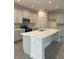 New kitchen featuring white cabinets, stainless appliances, a large island, and tiled backsplash at 7980 Syracuse Dr, Clermont, FL 34714