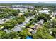 A high aerial view of a neighborhood featuring mature trees and a glimpse of the city skyline at 815 W Yale St, Orlando, FL 32804