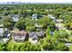 Aerial view of a home with trees, a spacious backyard and neighborhood streets nearby at 815 W Yale St, Orlando, FL 32804