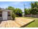 A large wooden deck in the backyard, perfect for outdoor living and entertaining at 815 W Yale St, Orlando, FL 32804