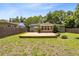 Large backyard with a wood deck, lawn and a privacy fence great for entertaining at 815 W Yale St, Orlando, FL 32804