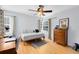 Bright bedroom features a daybed, hardwood floors, ceiling fan, and ample natural light at 815 W Yale St, Orlando, FL 32804