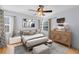 Stylishly decorated bedroom with hardwood floors, a cozy bed, and elegant furnishings at 815 W Yale St, Orlando, FL 32804