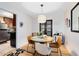 Inviting dining area with stylish lighting, hardwood floors, and access to the kitchen at 815 W Yale St, Orlando, FL 32804