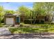 Charming home featuring a manicured lawn, palm trees, and a bright blue front door at 815 W Yale St, Orlando, FL 32804
