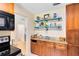Kitchen featuring custom display shelving and granite countertops at 815 W Yale St, Orlando, FL 32804