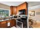 This kitchen features granite countertops, stainless steel appliances, and wooden cabinets at 815 W Yale St, Orlando, FL 32804