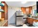 Well-lit kitchen featuring granite countertops and stainless steel appliances at 815 W Yale St, Orlando, FL 32804
