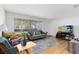 Cozy living room with large window, hardwood floors, and comfortable seating at 815 W Yale St, Orlando, FL 32804