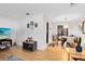 Open-concept living and dining area with hardwood floors and neutral decor at 815 W Yale St, Orlando, FL 32804