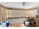 Enclosed sunroom awaiting decor with multiple windows and tile flooring at 815 W Yale St, Orlando, FL 32804