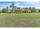 A view of the large backyard, which includes the rear of the house at 9729 Lake Hugh Dr, Gotha, FL 34734