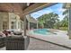The backyard features a swimming pool and outdoor seating area at 9729 Lake Hugh Dr, Gotha, FL 34734