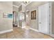 Open bathroom design featuring a walk-in shower with glass partition and neutral tile flooring at 9729 Lake Hugh Dr, Gotha, FL 34734