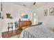 Comfortable bedroom includes wood dresser, TV, and a calming color scheme at 9729 Lake Hugh Dr, Gotha, FL 34734