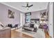 Bedroom with ceiling fan, accent furniture, wood floors and neutral paint at 9729 Lake Hugh Dr, Gotha, FL 34734