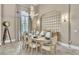 Formal dining room featuring a decorative chandelier, tile flooring, and a set dining table at 9729 Lake Hugh Dr, Gotha, FL 34734