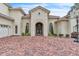 Elegant home featuring a spacious brick driveway with an arched front entry and a three-car garage at 9729 Lake Hugh Dr, Gotha, FL 34734