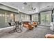 Spacious game room with foosball table, pub seating, and comfortable lounge area with outside access at 9729 Lake Hugh Dr, Gotha, FL 34734