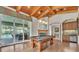 Bright game room with access to the pool area and a wet bar for entertaining at 9729 Lake Hugh Dr, Gotha, FL 34734