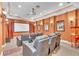 Lavish home theater with plush seating, large screen, projector, and vintage-style popcorn machine at 9729 Lake Hugh Dr, Gotha, FL 34734