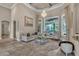 Inviting living room featuring tile floors, chandelier, large windows, and neutral décor at 9729 Lake Hugh Dr, Gotha, FL 34734