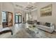 Bright and open living area with soaring ceilings, elegant decor, and plenty of natural light at 9729 Lake Hugh Dr, Gotha, FL 34734