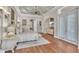 Lovely main bedroom with a sitting area, hardwood floors and trey ceiling at 9729 Lake Hugh Dr, Gotha, FL 34734