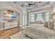 Beautiful main bedroom with bay windows, a sitting area, and hardwood floors at 9729 Lake Hugh Dr, Gotha, FL 34734