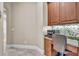A cozy office nook area featuring desk and cabinetry at 9729 Lake Hugh Dr, Gotha, FL 34734