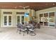 Outdoor dining area overlooking pool at 9729 Lake Hugh Dr, Gotha, FL 34734
