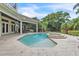 Beautiful backyard featuring a pool with a hot tub and fountain feature, perfect for outdoor relaxation at 9729 Lake Hugh Dr, Gotha, FL 34734