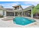 The backyard pool has an attached spa and manicured landscaping at 9729 Lake Hugh Dr, Gotha, FL 34734