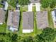 Aerial view of home showing screened lanai and pool in fenced back yard at 10875 Arbor View Blvd, Orlando, FL 32825